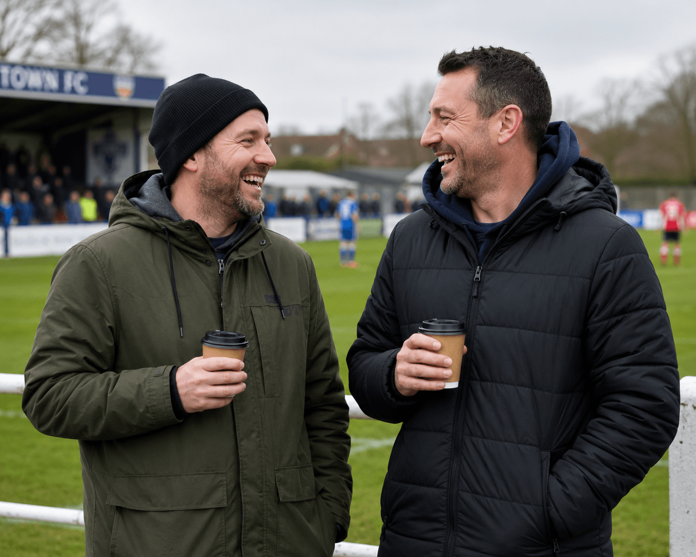 Two mates catching up over takeaway coffee at a local footy ground