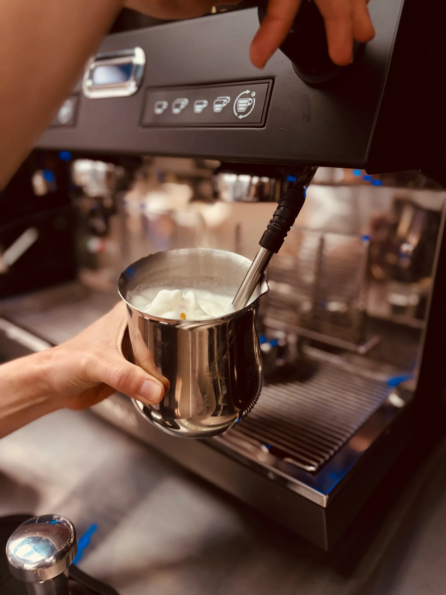 Steaming silky milk for a coffee at the van