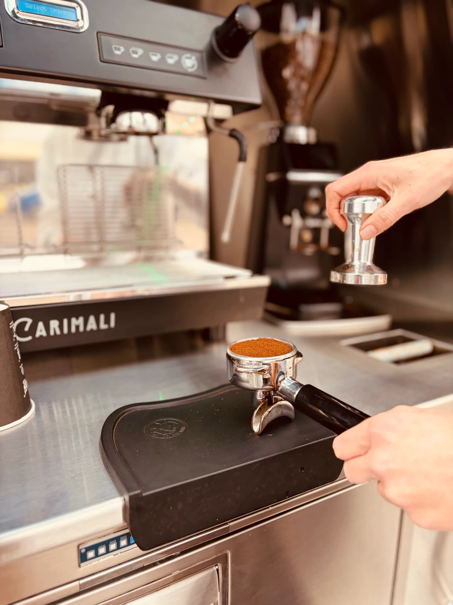 Tamping an espresso shot at the coffee van
